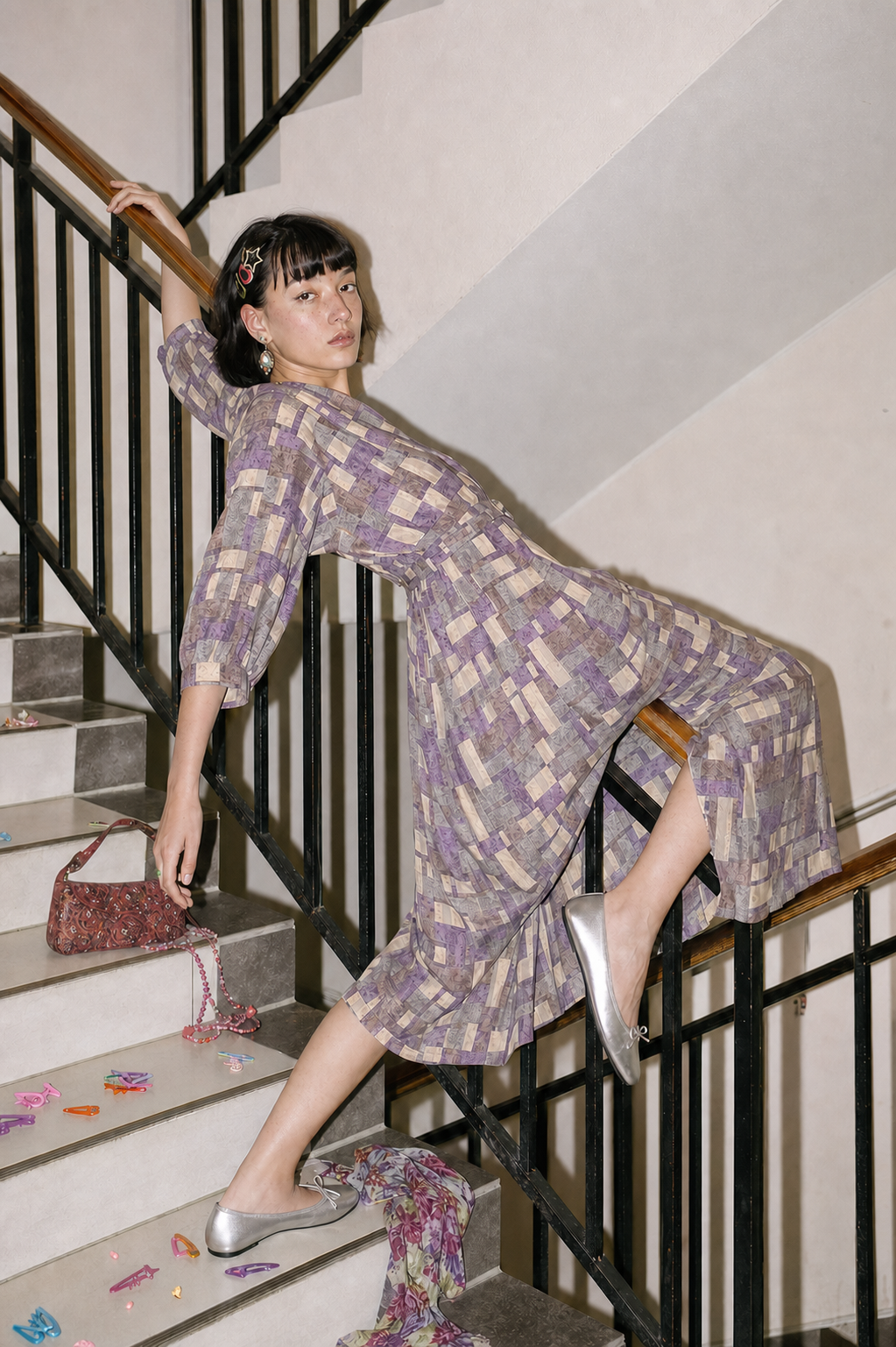 Purple geometric dress on stairs